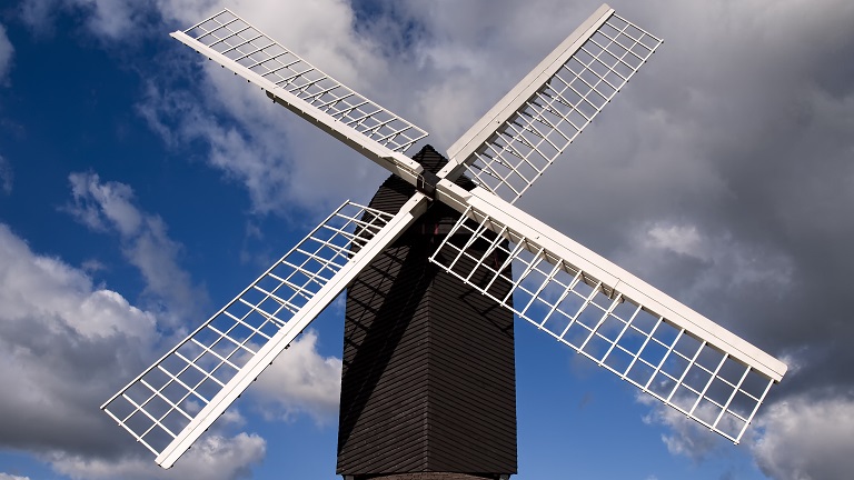 A view of Brill windmill with blue skies and clouds in the background