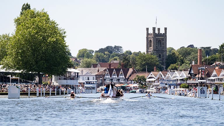 Teams rowing down the Thames during Henley Royal Regatta