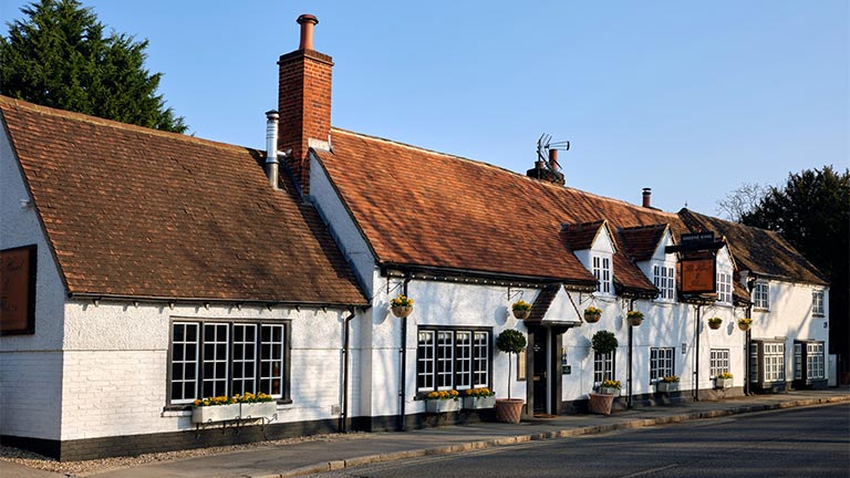 The quaint white-washed exterior of The Hand and Flowers in Marlow