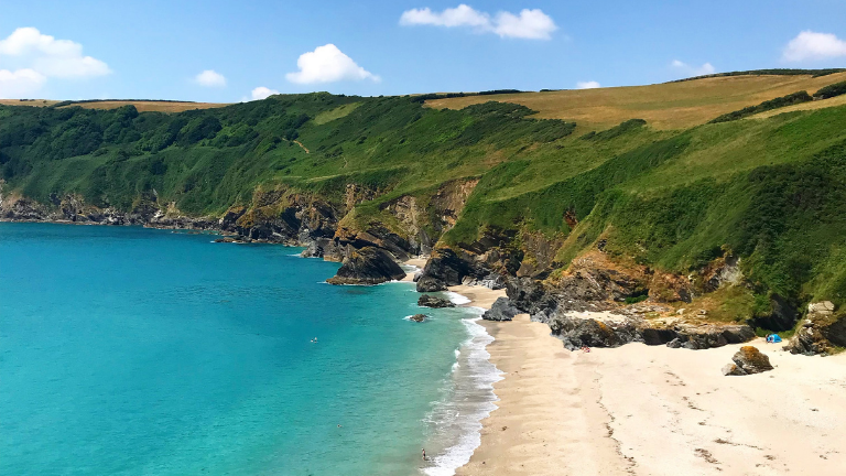 The cliffs, beach and sea at Lantic Bay in Cornwall