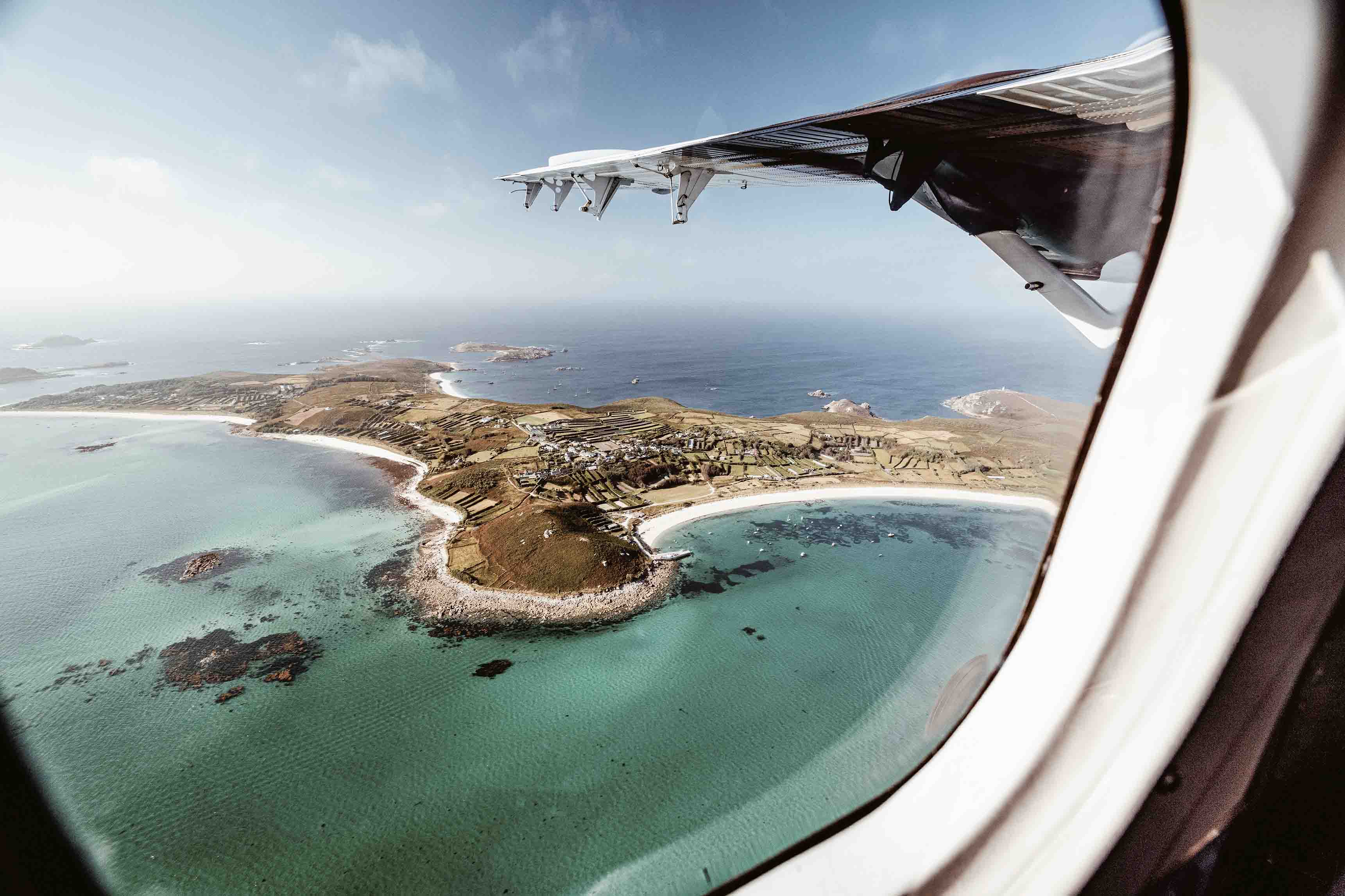 Plane flying over the Scilly Isles