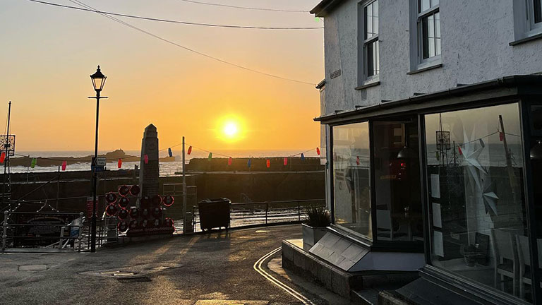 Outside of 2 Fore Street restaurant at sunset in Mousehole