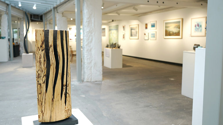Inside the contemporary interiors of Penwith Gallery in St Ives, with paintings and sculptures on show