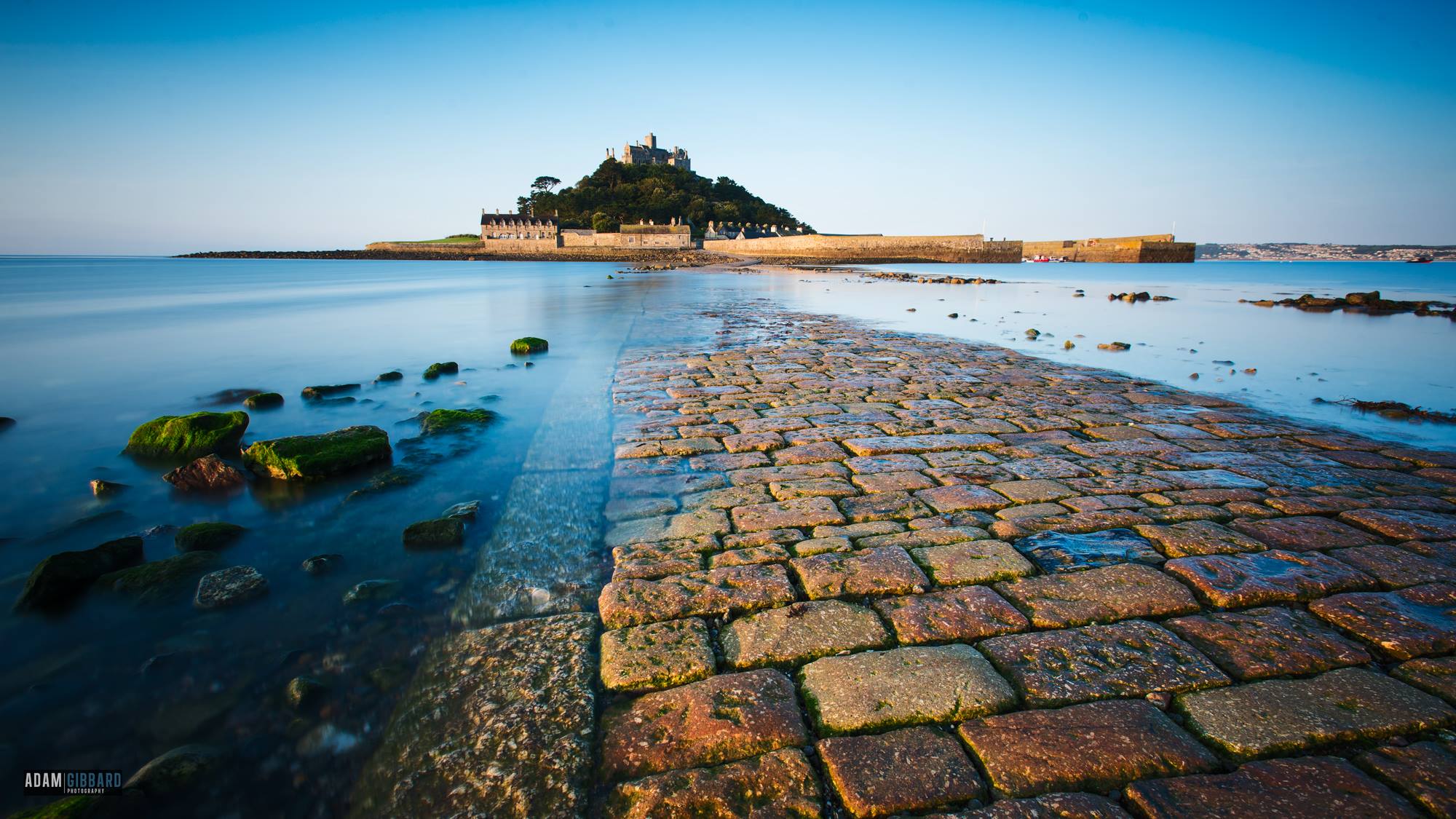 An image of St Michael's Mount and its cobbled causeway near Marazion in West Cornwall 