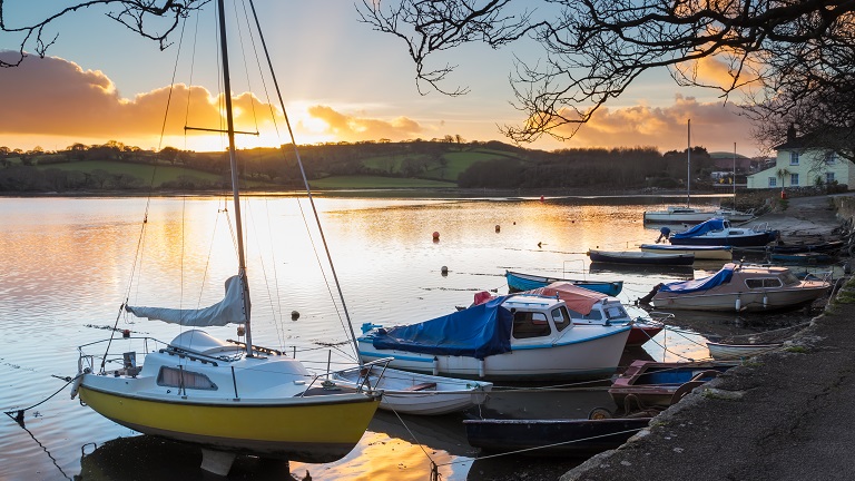 Boats along the riverbanks in Truro 
