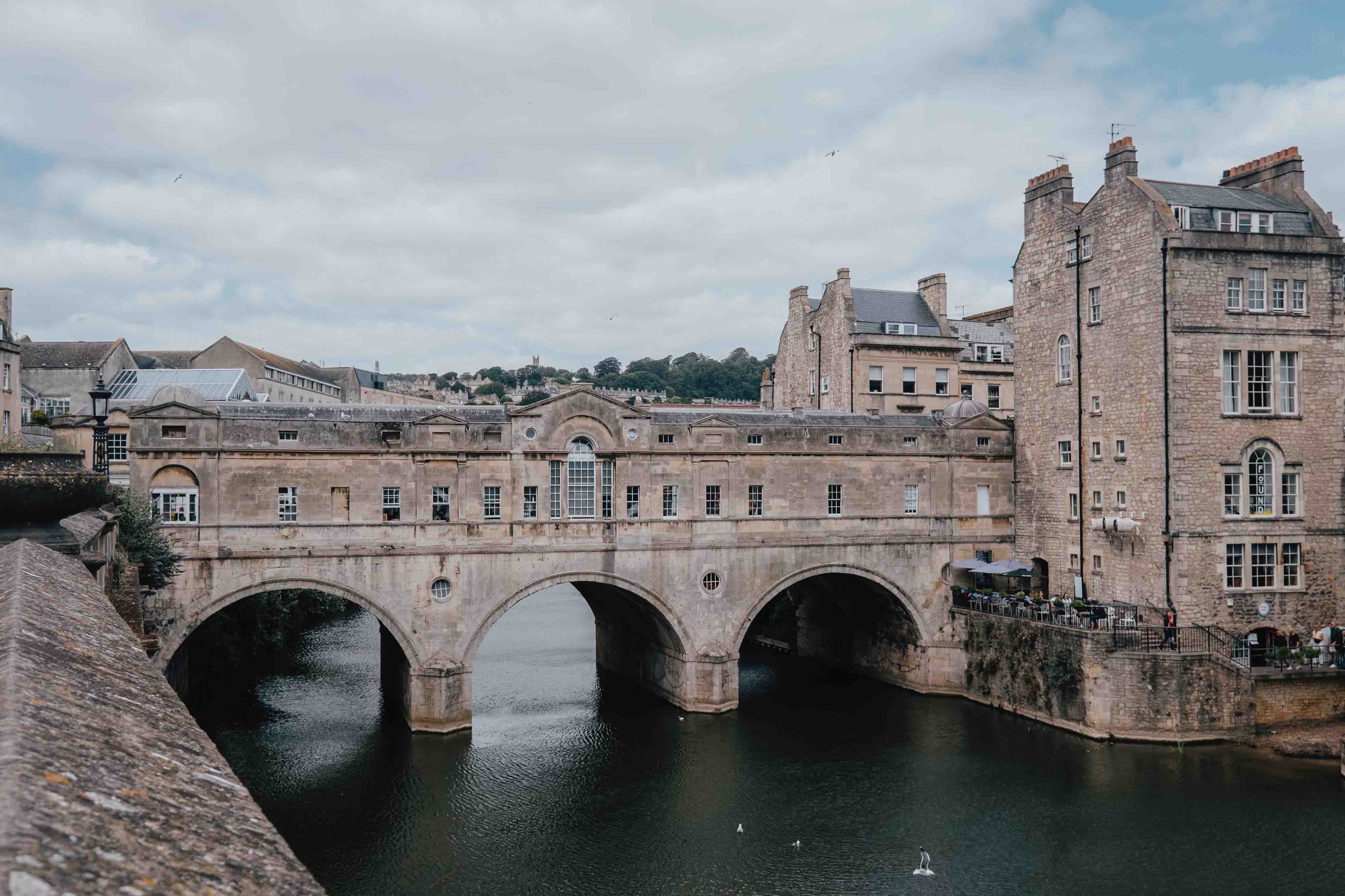 A heritage bridge spanning a river in the historic city of Bath