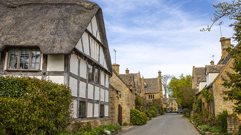 Historic stone and timber-framed houses in the pretty village of Stanton in the Gloucestershire Cotswolds