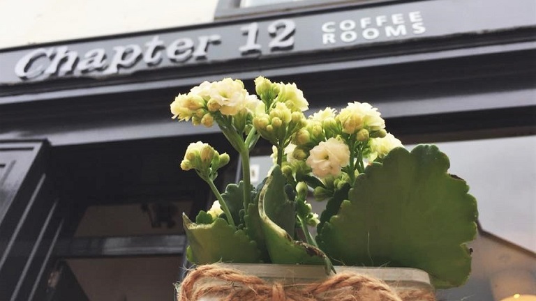 The frontage of Chapter 12 Coffee Rooms and Bistro in Penrith with flowers in the foreground. One of the top cafes in Penrith. 