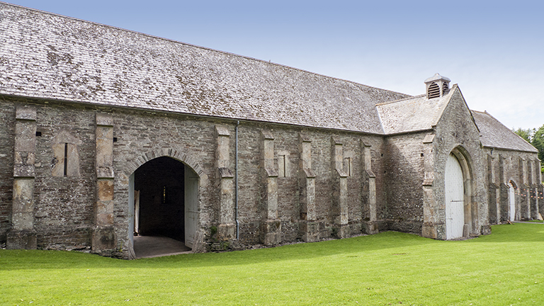 The stone walls and large doorways of Buckland Abbey