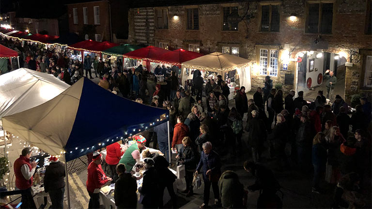 Merrymakers perusing the stalls at Cerne Abbas Christmas Fayre