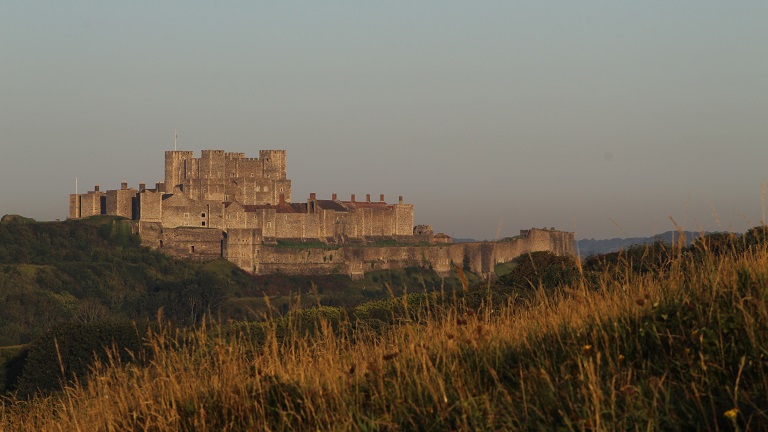 A distant view of the impressive Dover Castle, known as the "Lock and Key of England" for its important defensive position