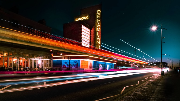 A night-time, time-lapse view of the outside of Dreamland theme park in Margate, Kent