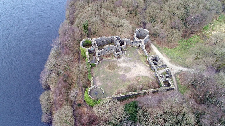 An aerial view of Liverpool Castle in Rivington near Chorley next to the water and surrounded by trees