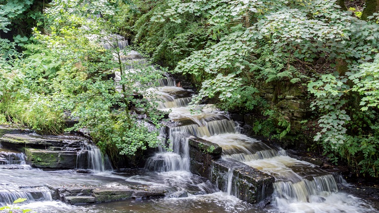 A little waterfall at Yarrow Valley Country Park near Chorley, a 700 acre park perfect for walking, biking and wildlife watching