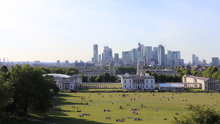 A view of Greenwich Park with the city of London in the background 