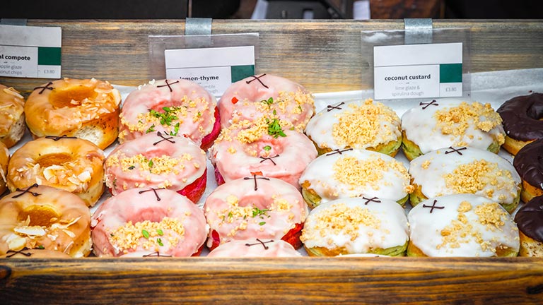An incredible selection of colourful artisan doughnuts at Broadway Market in London