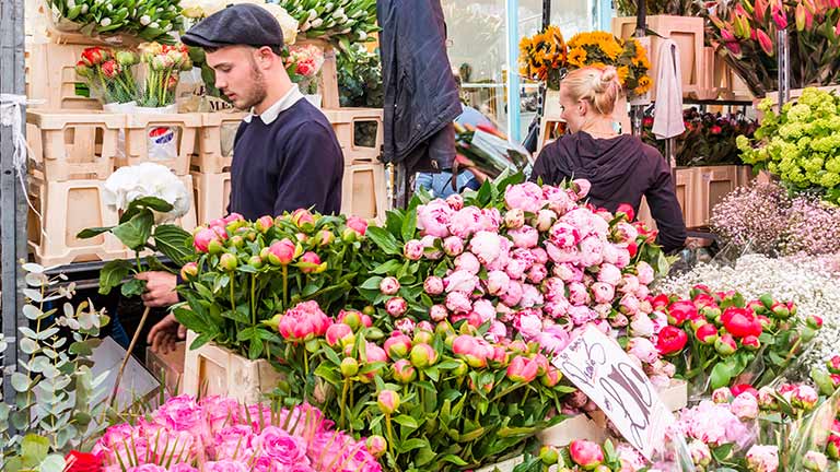 A stall full of different roses at the Columbia Road Flower Market in London
