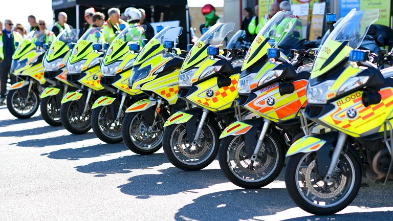 A row of Cornwall Blood Bike motorcycles ready for action