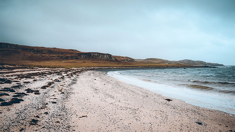 The sweeping white coral and sandy beach at Coral Beach on the Isle of Skye