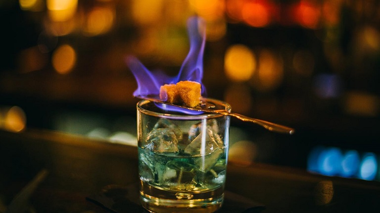 A flaming absinthe drink served at the Opium Bar in Bath