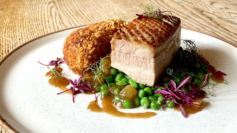 Image by the Hoods Arms in Kilve of plated food including belly pork