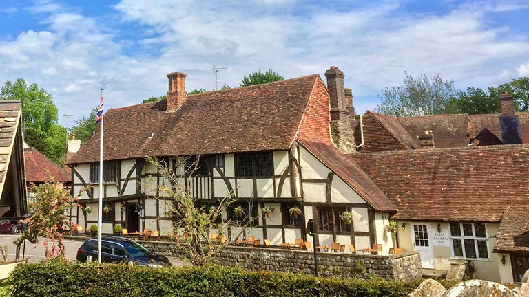 Traditional timber-clad exterior of the award-winning Crown Inn pub in Chiddingfold