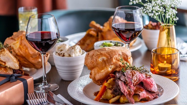 A delicious Sunday roast served with a glass of red wine at The Seahorse