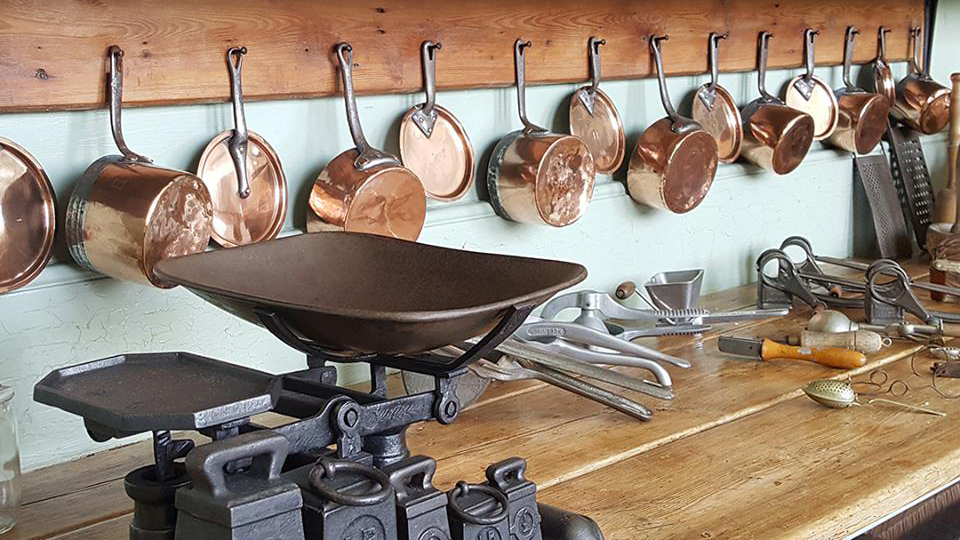Bronze pots and pans in the kitchens of Stansted Park's great house