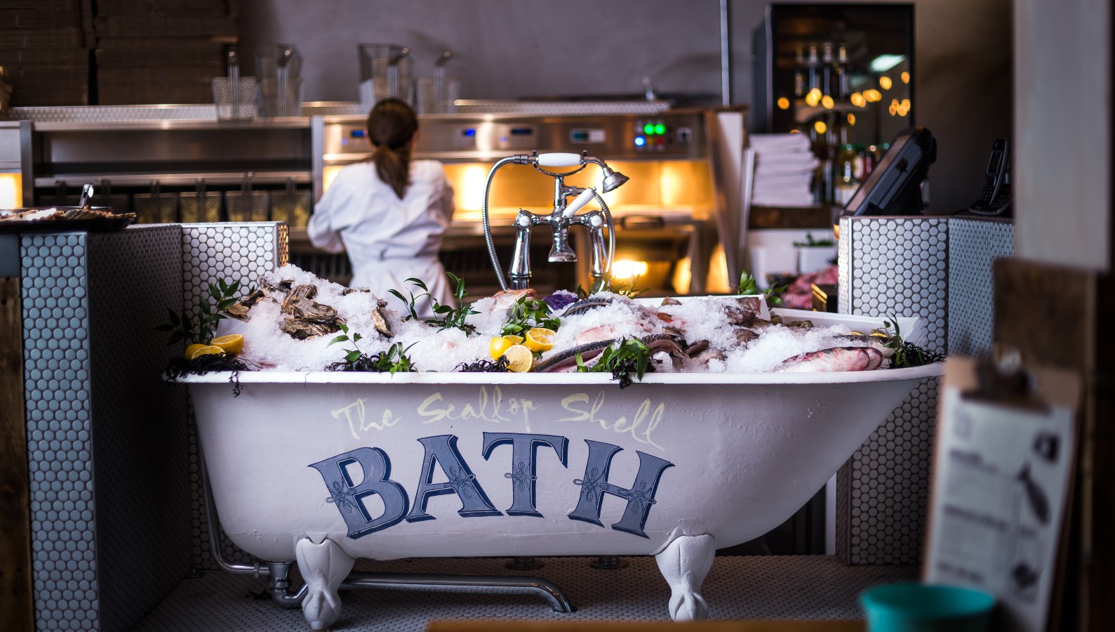 Seafood and shellfish served on ice in a miniature bathtub in the Scallop Shell restaurant in Bath