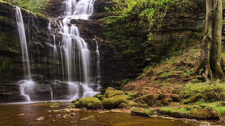 The flowing waters of Stainforth Force in Yorkshire