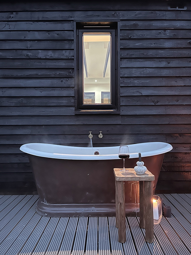 Outdoor bathtub at Black Box Cabin