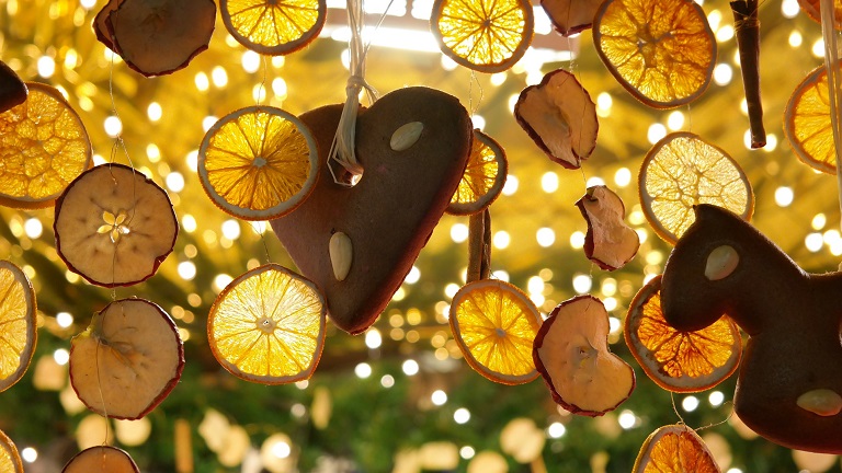 Dried fruit slice decorations hanging from Christmas stalls