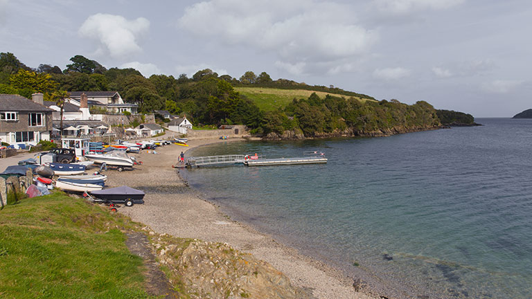 Overlooking Helford Passage beach with its ferry landing, boats and cute array of shops and eateries