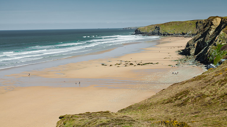 A view from the cliffs overlooking the honey-hued sands of Watergate Bay, North Cornwall