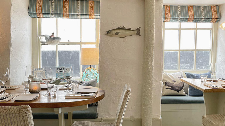 Inside the fisherman's cottage interiors of Outlaw's Fish Kitchen restaurant in Port Isaac