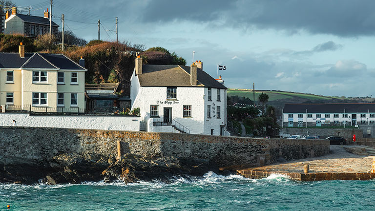A view of The Ship Inn from the opposite side of the harbour in Porthleven