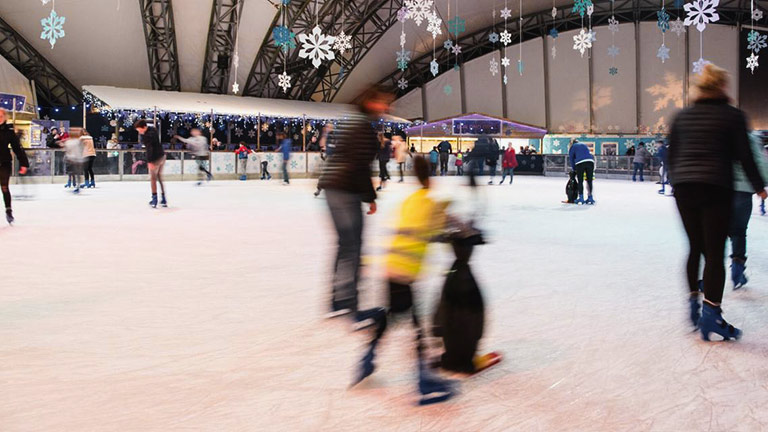 Skaters gliding across The Eden Project's seasonal ice rink