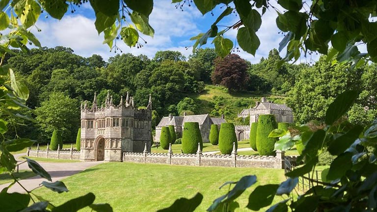The Alice in Wonderland-style gardens of Lanhydrock with large topiary and manicured lawns