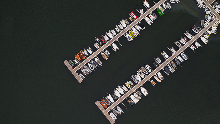 An aerial view of boats moored at Helford River Sailing Club's pontoons