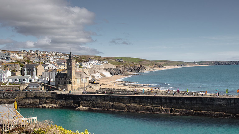 A beautiful view of Porthleven with its clock tower and golden sand beaches