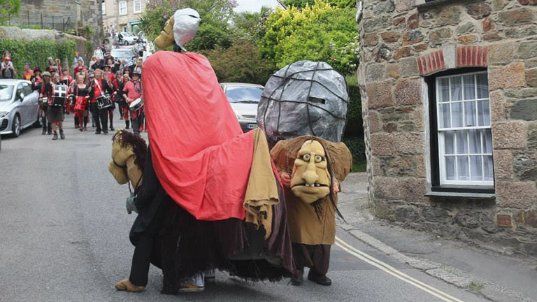 Locals celebrating the traditional St Agnes Bolster Day, dressed in costume and playing museum