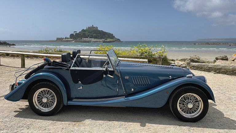 One of the beautiful classic cars from Perranwell Classic Car Garage in front of St Michael's Mount