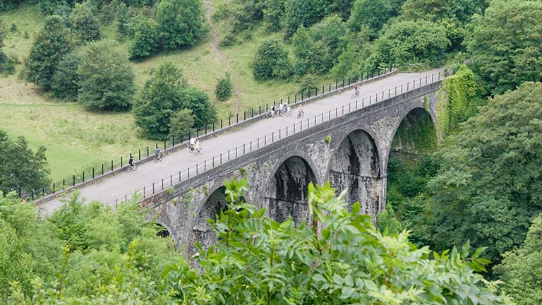 The famous Monsal viaduct reaching above the trees