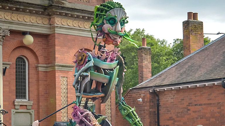 A giant puppet sculpture operated by people at Ashbourne Festival