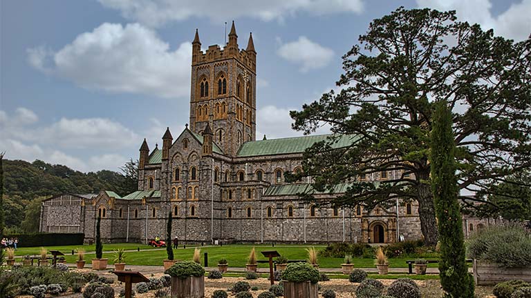The grand and beautiful Buckfast Abbey with the pretty manicured gardens in front