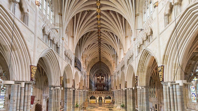 Inside the decorated body of Exeter Cathedral with its historic ribbed ceilings