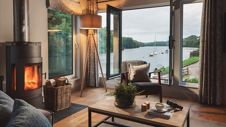 The warmly illuminated interiors and river views of Watermark beside Tuckenhay Quay