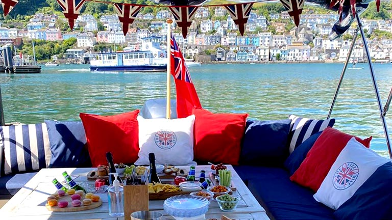 Plump cushions, food and fizz about the Dartmouth Fizz Boat in Devon