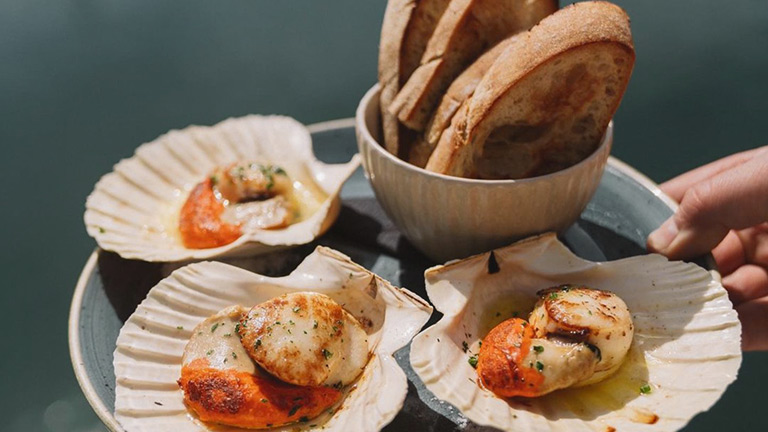 A plate of scallops served at England's Seafood Feast