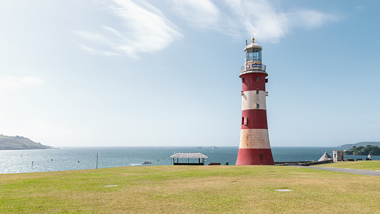 A view of Smeaton Tower and the sea beyond in Plymouth, Devon